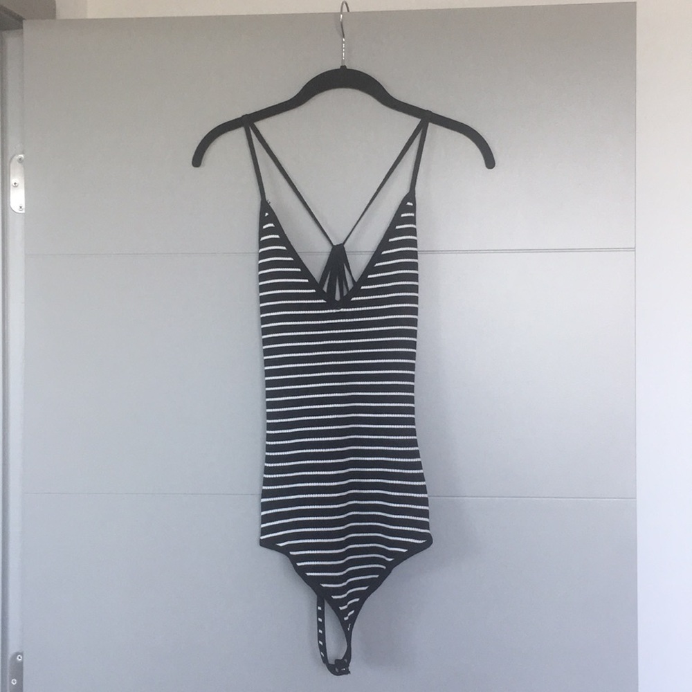 Black and white body suit.